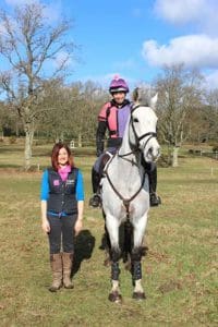 Nicki Kavanagh standing next to Ginny Howe who is on a horse in a field