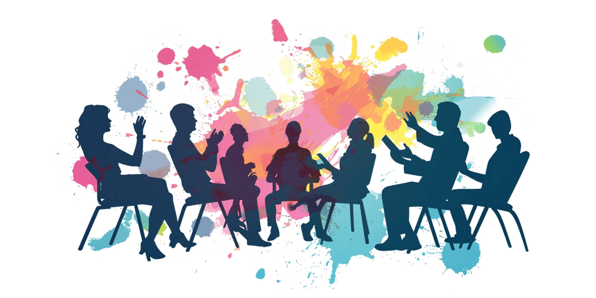 Silhouettes of people seated in a colourful group discussion