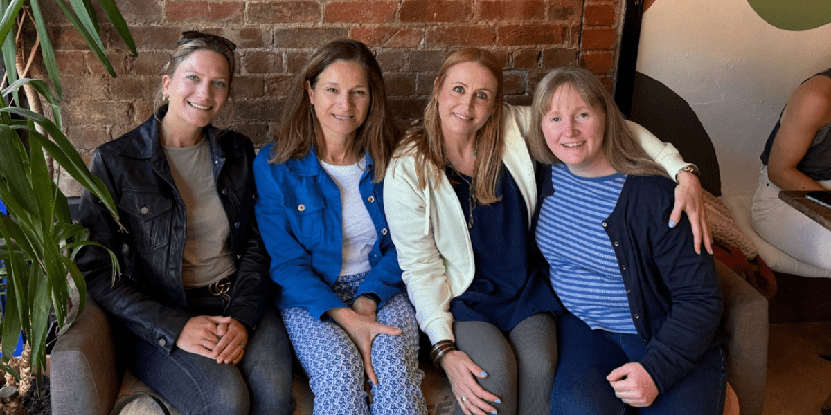 The Juniper team sitting together on a sofa
